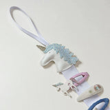 Percha con clip de unicornio