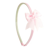 Diadema estrecha con lacito rosa pastel